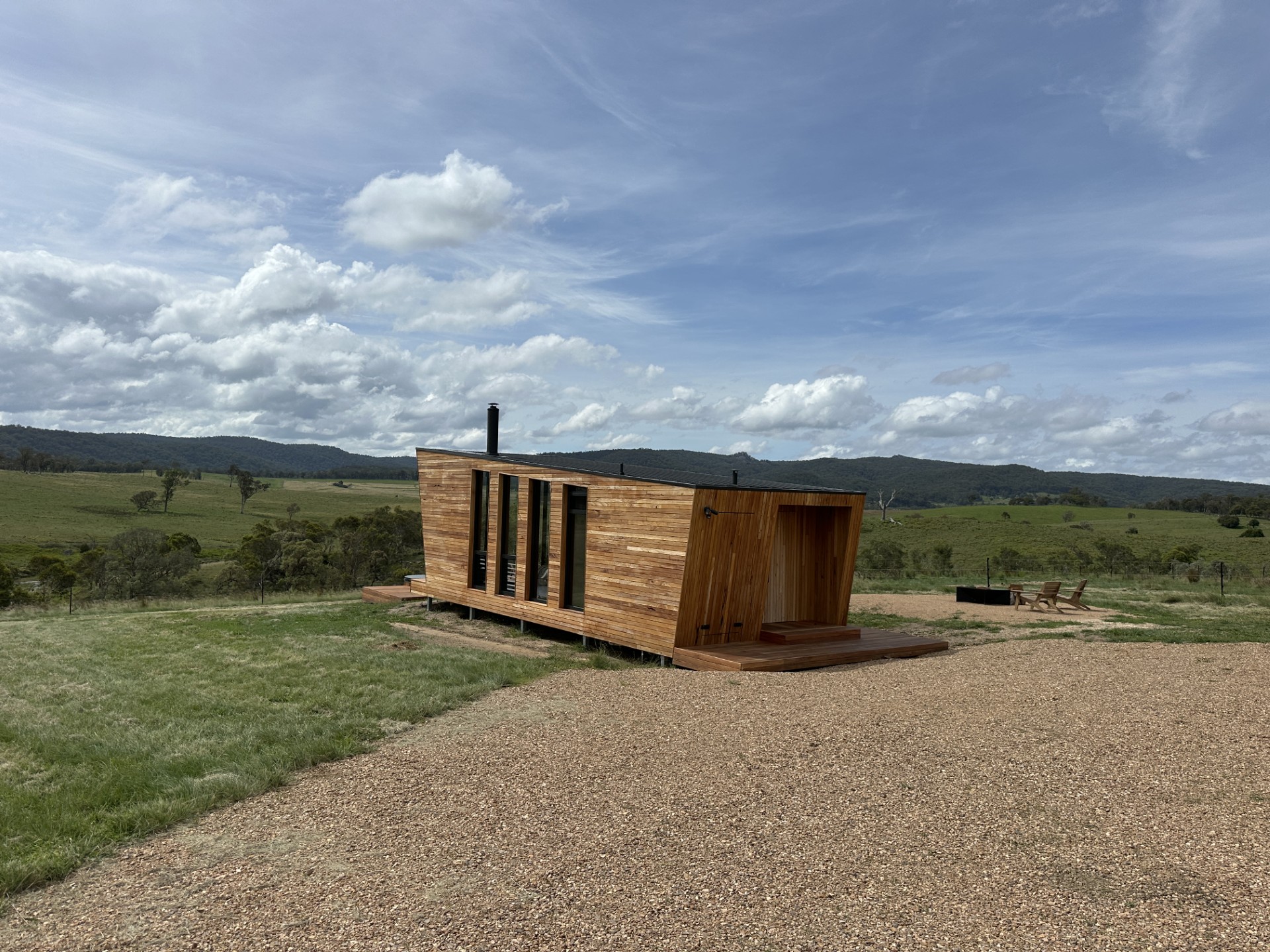 Cabin sitting in open paddock landscape at Gabarraa Luxury Escape.