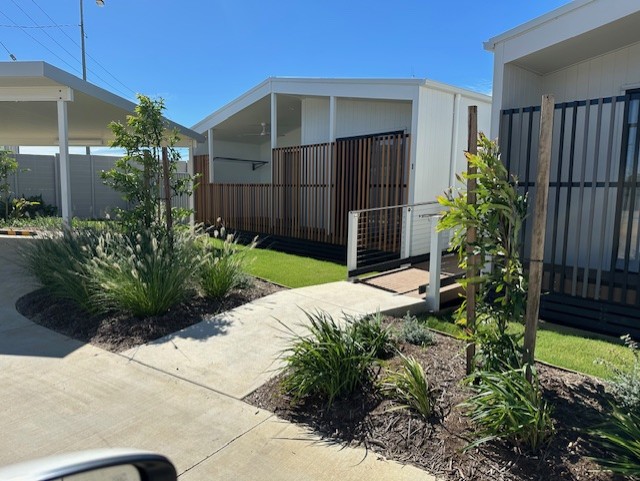 Accessible path and planted frontage at EndED Accommodation Village.